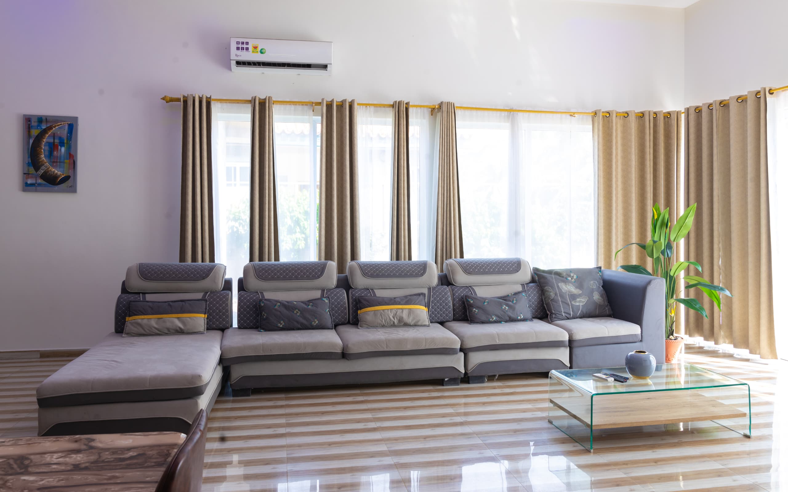 Contemporary lounge with beige curtains