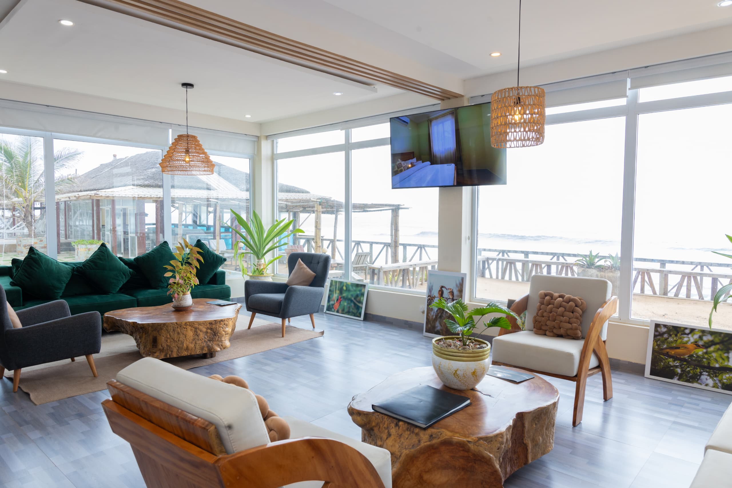 Modern beachfront lounge with green velvet sofa